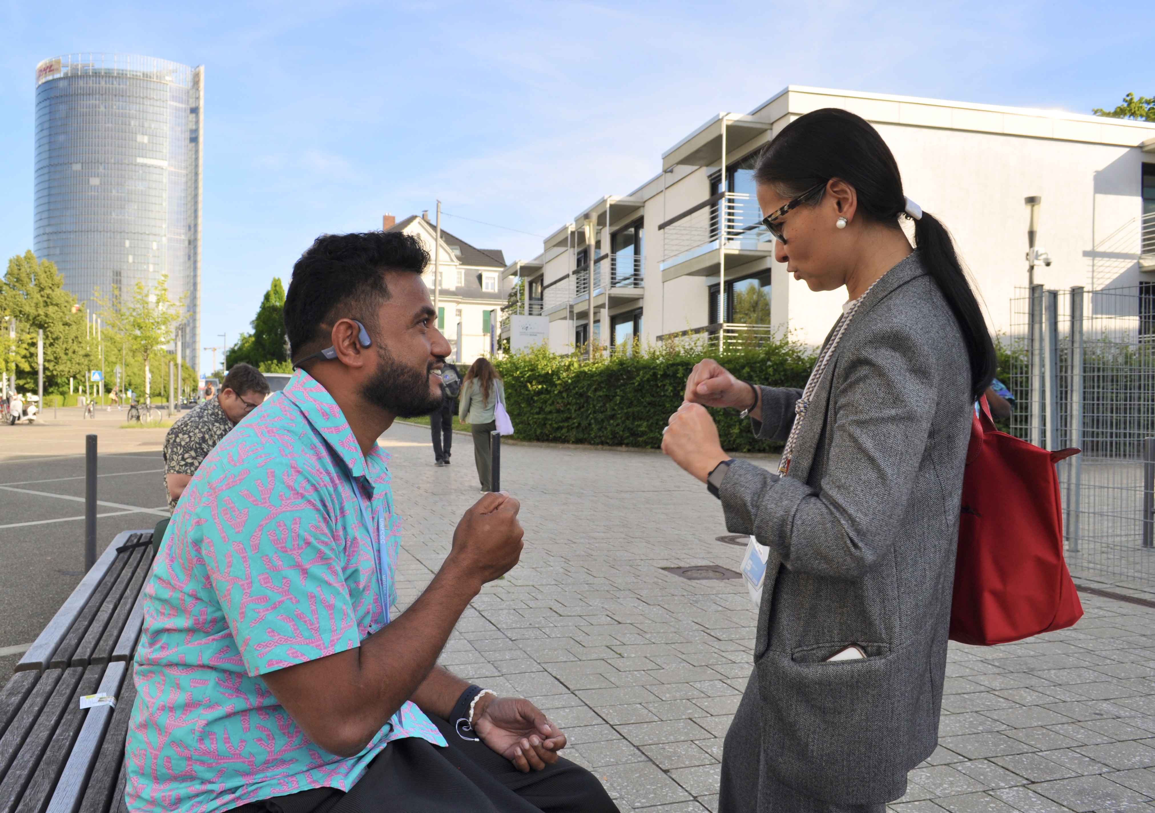 [16] At the end of the fifth day of SB62, Robert David Karoro, a negotiator from Kiribati, gets cheered on by a fellow member of the Alliance of Small Island States (AOSIS). 