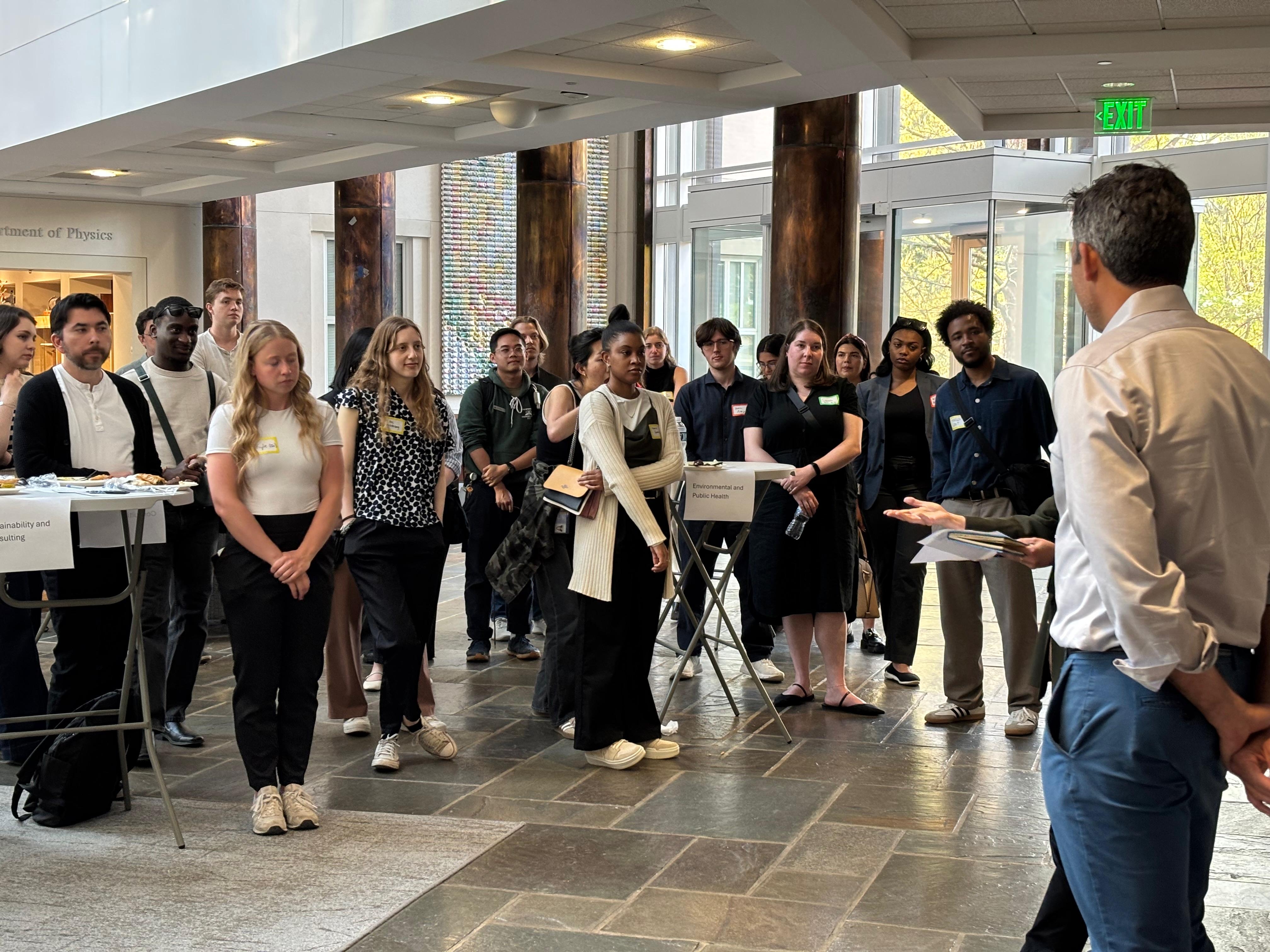 Students and alumni listen intently to Michael Coren's stories and advice.